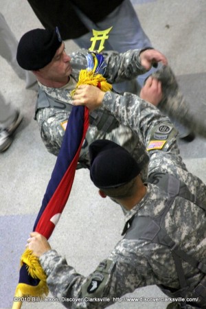 Command Sgt. Maj. Gregory Patton (Left) & Col. Viet Luong (Right), case the brigade colors.