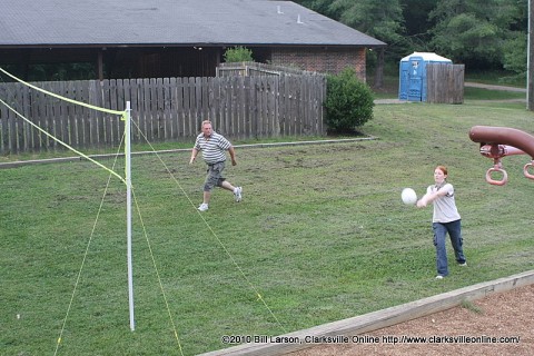 Clarksville Parks and Recreation Director Mark Tummons heads for the net as his partner returns a volley
