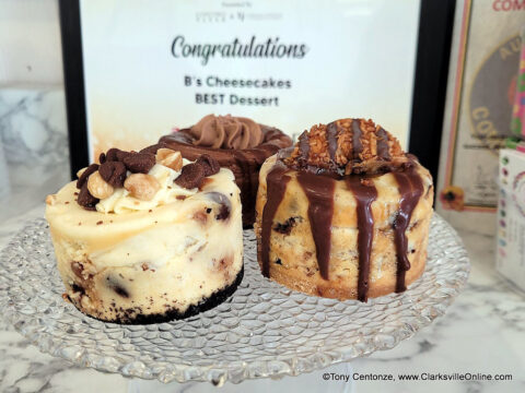 Three mini cheesecakes from B's Cheesecakes: Caramel Coconut Cookie with Samoa on top, Triple Chocolate in the back, and Tollhouse Chocolate with Peanut Caramel.