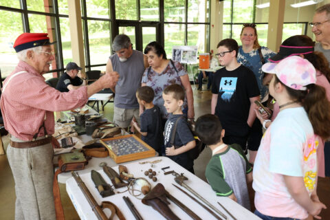 George Wallace telling visitors about some of the equipment a soldier might have carried during the Civil War. (Mark Haynes, Clarksville Online)