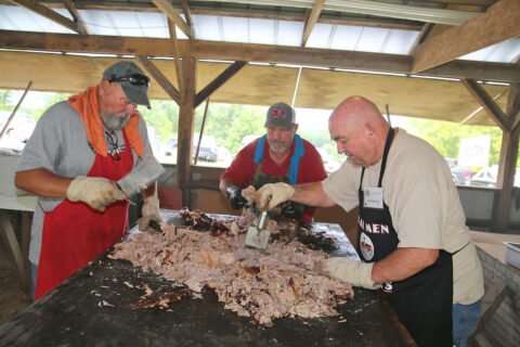 Central Civitan Club members preparing BBQ for the Lone Oak Picnic. (Discover Clarksville)