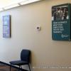 University of Phoenix Posters decorate a wall.