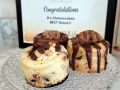 Three mini cheesecakes from B's Cheesecakes: Caramel Coconut Cookie with Samoa on top, Triple Chocolate in the back, and Tollhouse Chocolate with Peanut Caramel.